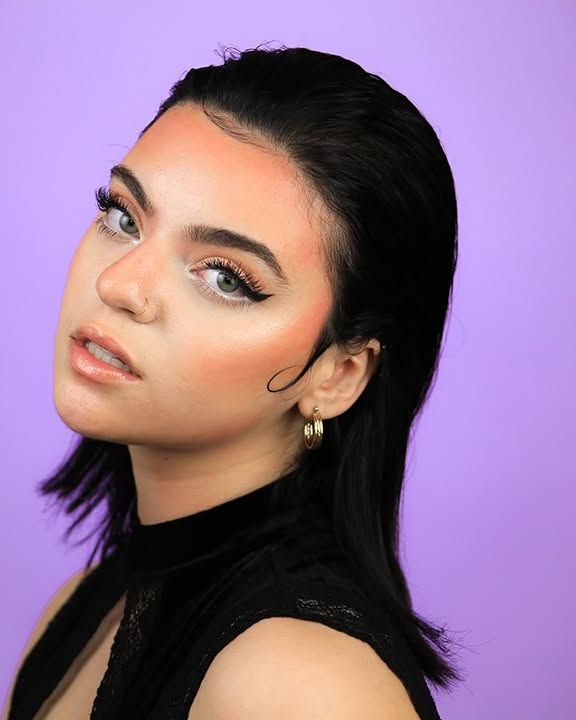 Actor headshot, lavender backdrop