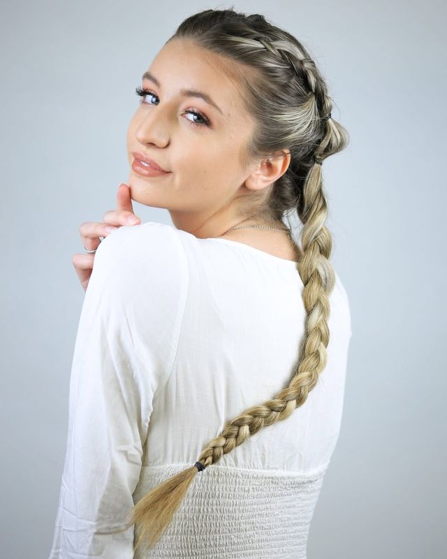 Actor headshot, braid, cool gray backdrop
